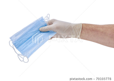 Doctors male hands in medical gloves holding a medical mask isolated white Doctors male hands in medical gloves holding a medical mask isolated white 70103778