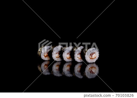 Fresh delicious beautiful sushi rolls on a dark background 70103826