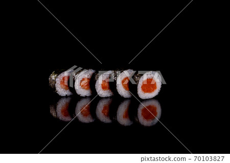 Fresh delicious beautiful sushi rolls on a dark background Fresh delicious beautiful sushi rolls on a dark background 70103827