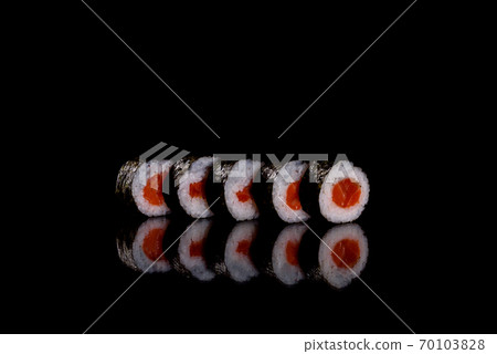 Fresh delicious beautiful sushi rolls on a dark background 70103828