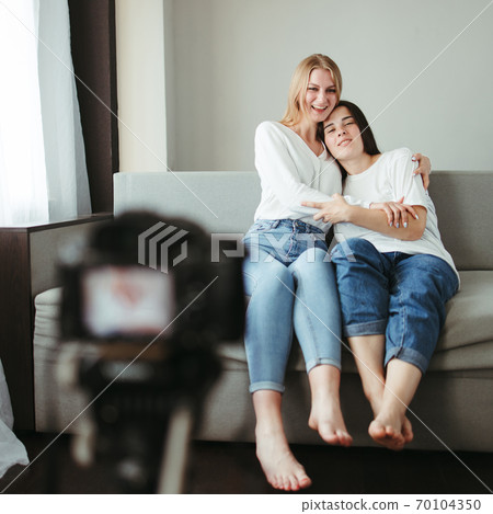 Two female bloggers streaming online video 70104350