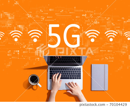 5G network with person using a laptop 5G network with person using a laptop 70104429