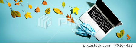 Laptop computer with masks in autumn Laptop computer with masks in autumn 70104438