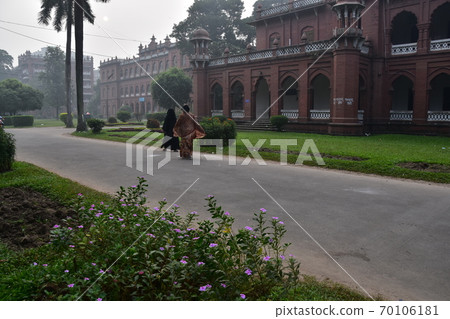 Dhaka, the capital of Bangladesh, a historic building, Curzon Hall, a Muslim woman taking a walk in the morning 70106181