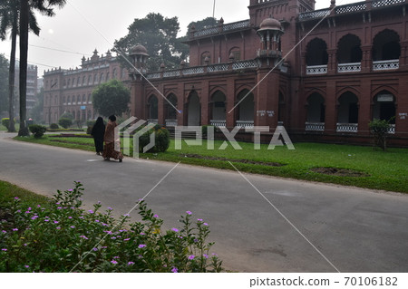 Dhaka, the capital of Bangladesh, a historic building, Curzon Hall, a Muslim woman taking a walk in the morning 70106182
