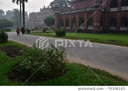 Dhaka, the capital of Bangladesh, a historic building, Curzon Hall, a Muslim woman taking a walk in the morning Dhaka, the capital of Bangladesh, a historic building, Curzon Hall, a Muslim woman taking a walk in the morning 70106183