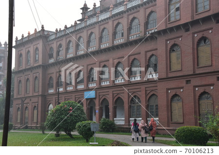 Dhaka, the capital of Bangladesh, a historic building, Curzon Hall, a Muslim schoolgirl heading to the university Dhaka, the capital of Bangladesh, a historic building, Curzon Hall, a Muslim schoolgirl heading to the university 70106213