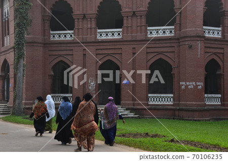 Dhaka, the capital of Bangladesh, a historic building, Curzon Hall, a Muslim woman taking a walk in the morning 70106235