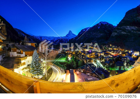 Beautiful view of village in twilight time with Matterhorn peak background in Zermatt, Switzerland. 70109076