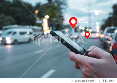People use smartphone to check map to travel with internet and gps application for vacation. 70110562