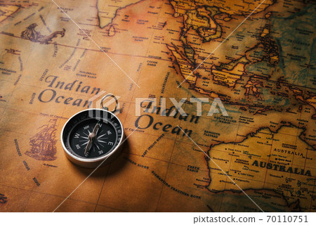 Old compass discovery on vintage paper antique world map Old compass discovery on vintage paper antique world map 70110751