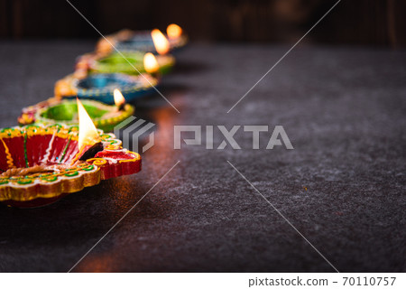 clay lit light a fire already on Diya or oil lamp clay lit light a fire already on Diya or oil lamp 70110757
