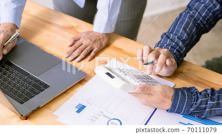 Business Corporate meeting using laptop at conference table discussing ideas for their business project in modern office. 70111079