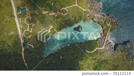 Top down of limpid turquoise lake with designed ways on green valley in aerial. Nobody Asia nature 70112114