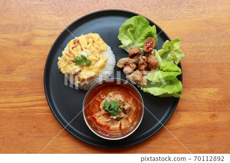 Breakfast in the round plate on the wooden floor. Breakfast in the round plate on the wooden floor. 70112892