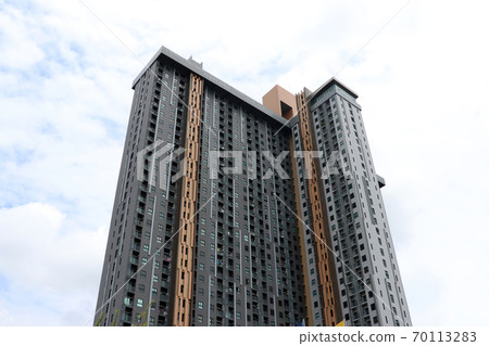 Pinnacle of building tower on sky background. 70113283