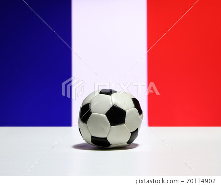 Small football on the white floor and Tri Color or blue white and red color of French nation flag 70114902