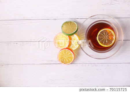 Close up of lemon tea on wooden background. 70115725
