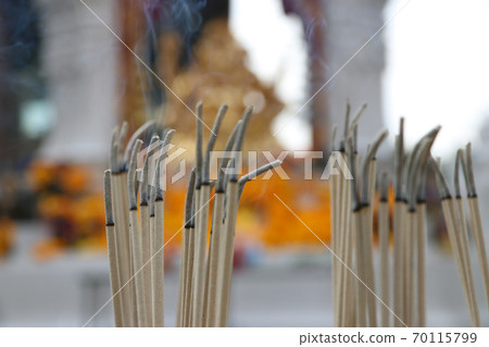 Incense sticks are lighten and incense smoke for worship Ganesha, out focus. Incense sticks are lighten and incense smoke for worship Ganesha, out focus. 70115799