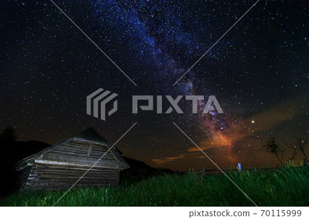 The Milky Way and old wooden hut, Transylvania, Romania, Europe 70115999
