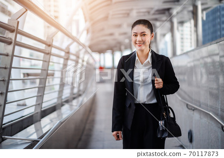 business woman walking in city 70117873