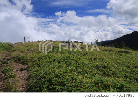 Northern Yatsugatake in early autumn, the summit of Mt. Twins Northern Yatsugatake in early autumn, the summit of Mt. Twins 70117985