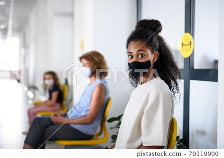 Portrait of girl with face mask, coronavirus, covid-19 and vaccination concept. 70119900