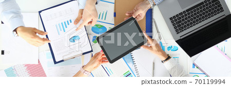 Businessmen and businesswomen at working steel discussing commercial indicators. 70119994