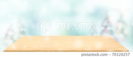 Perspective wood table with blur Christmas tree decorate string light and blue bokeh with snow light.Panoramic wooden countertop banner mock up for product display greeting card design online content Perspective wood table with blur Christmas tree decorate string light and blue bokeh with snow light.Panoramic wooden countertop banner mock up for product display greeting card design online content 70120257