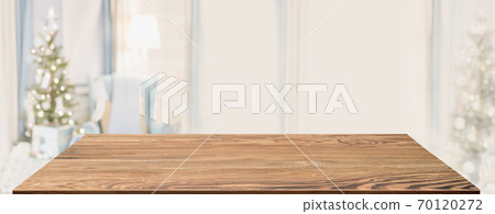 Wood table with Christmas decor in living room blur background with bokeh light,Holiday backdrop,Mockup banner for display of advertise product ,luxury house. Wood table with Christmas decor in living room blur background with bokeh light,Holiday backdrop,Mockup banner for display of advertise product ,luxury house. 70120272