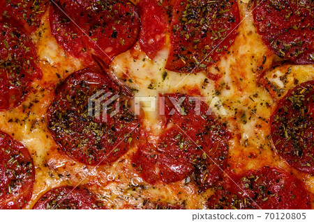 Texture of a delicious fresh pizza with sausage and cheese 70120805