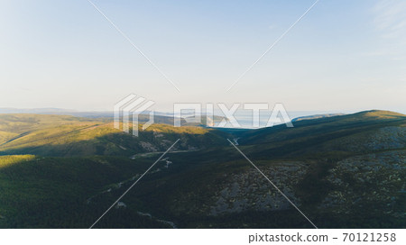 Sea bay surrounded by mountains. Peninsula Kony. The Sea of Okhotsk. Magadan Region. Russia. Sea bay surrounded by mountains. Peninsula Kony. The Sea of Okhotsk. Magadan Region. Russia. 70121258