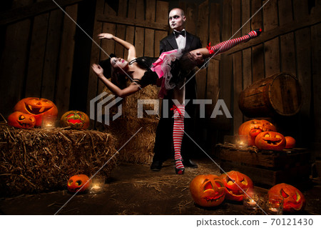 Vampires with Halloween pumpkins 70121430