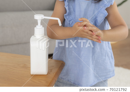 Up the hands of children who disinfect with alcohol Up the hands of children who disinfect with alcohol 70121792