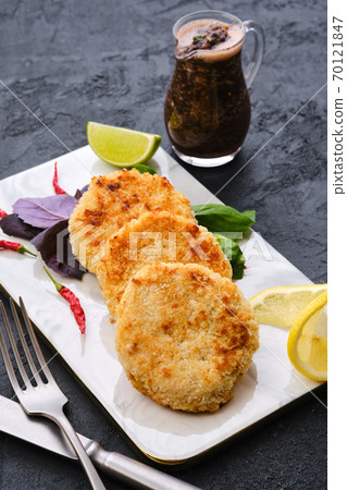 Potato pancakes stuffed with chopped trout Potato pancakes stuffed with chopped trout 70121847