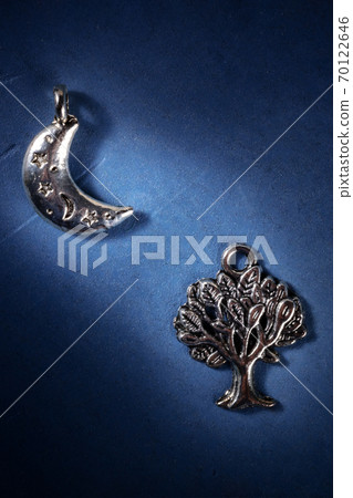 The Moon and the tree, silver pagan pendants, symbols of the Wiccan religion The Moon and the tree, silver pagan pendants, symbols of the Wiccan religion 70122646
