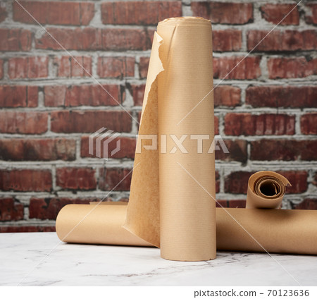 rolls of brown parchment paper on a white table rolls of brown parchment paper on a white table 70123636