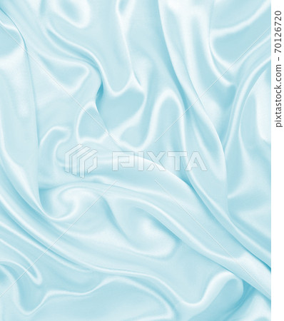 Smooth elegant blue silk or satin luxury cloth texture as abstract background. Luxurious background design 70126720