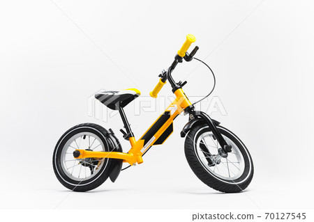 yellow balance bike on white background yellow balance bike on white background 70127545