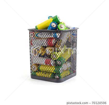 Basket with waste batteries on a white background. Battery recycling concept, business, electrical 70128506