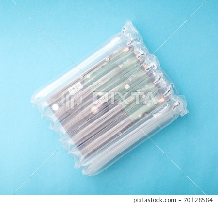 protective packaging made of polymers used for sending goods by mail. The concept of the integrity and safety of goods from shocks and damage during transportation, polyethylene 70128584