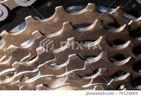 Bicycle stars on a bicycle chain mechanism, background, macro 70128609