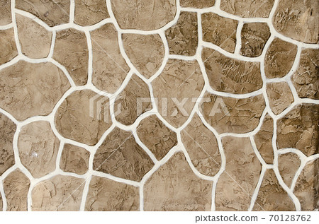 Decorative stucco wall of the house. Decorative stucco wall of the house. 70128762