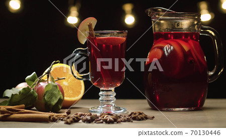 Red mulled wine in a glass and jug Red mulled wine in a glass and jug 70130446