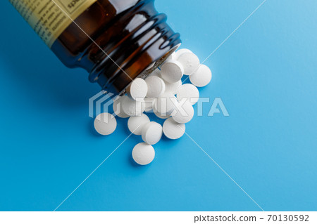 zinc tables, nutrition supplement pills on blue background 70130592