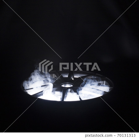 A modern beautiful automotive alloy wheel in the form of rays that is highlighted by rays of light and brilliance. Stylish cast smoke, industry 70131313