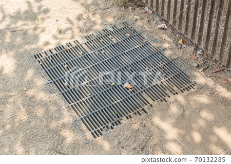 Drainage ditch beside the ground Drainage ditch beside the ground 70132285