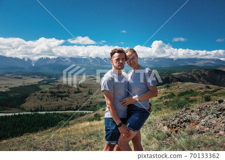 Loving couple together on mountain 70133362