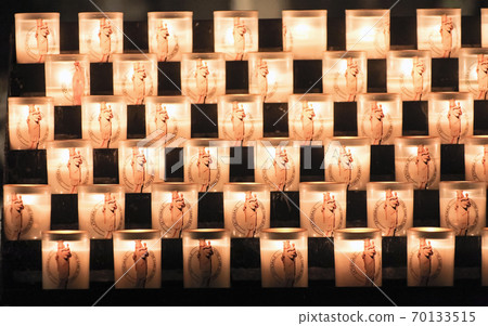 Glasses with candles for traditional religious ceremonies in a Christian Church. fire 70133515