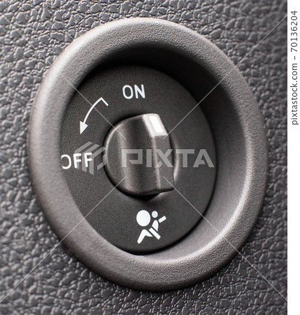 Front passenger airbag on and off switch, background Front passenger airbag on and off switch, background 70136204